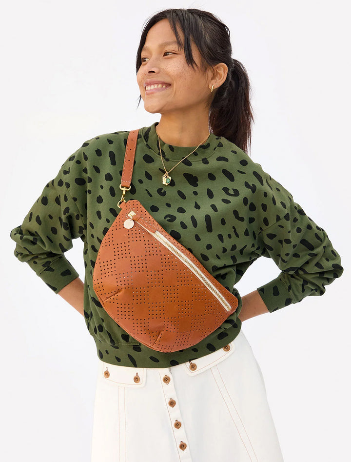 Model wearing Clare V.'s grande fanny in cuoio lightweight checker perf.