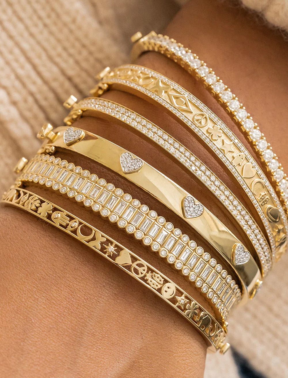 Model wearing Sydney Evan's pave heart hinged bangle.