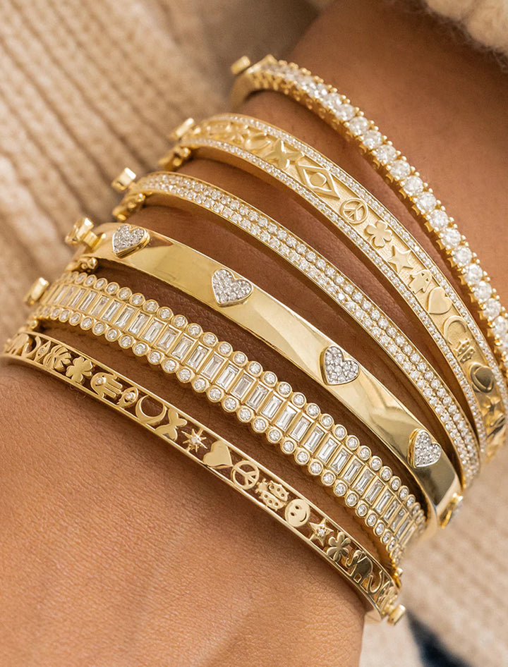 Model wearing Sydney Evan's pave heart hinged bangle.