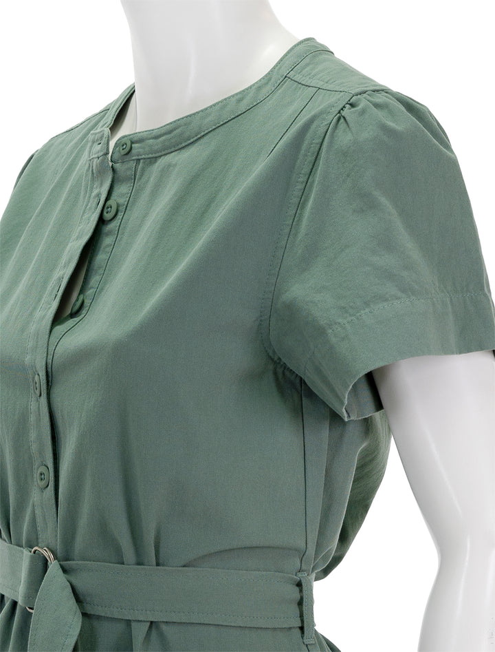 Close-up view of Lilla P.'s half-placket canvas dress in seagrass.