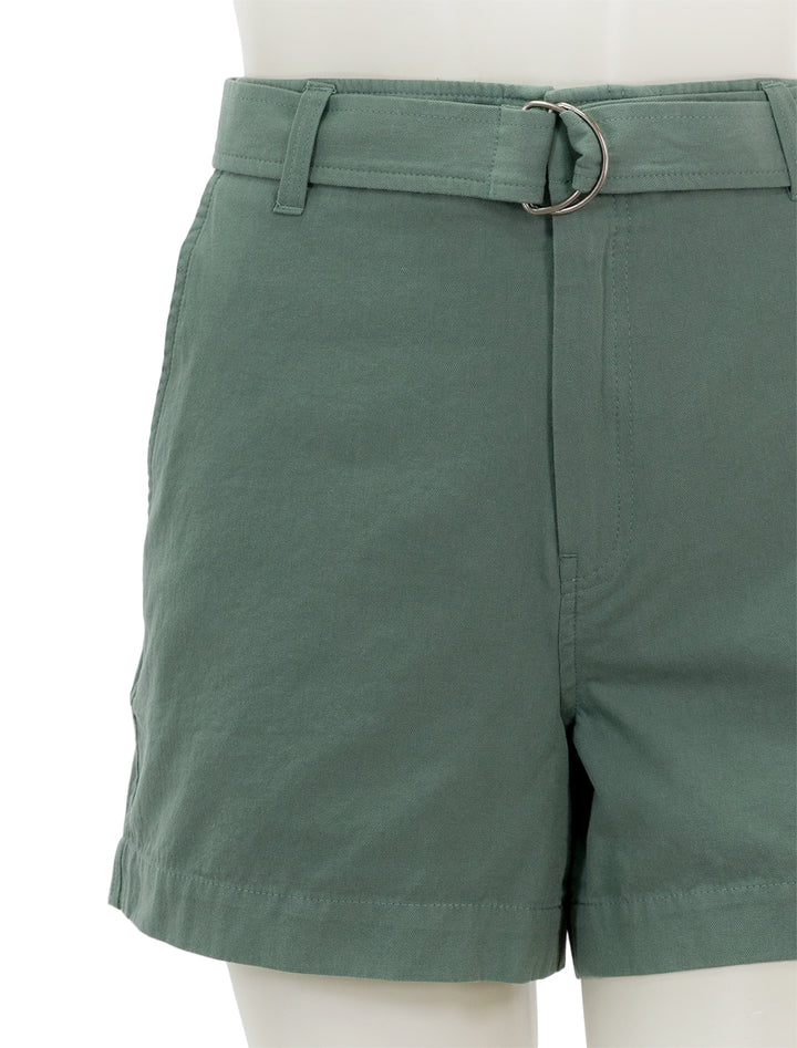 Close-up view of Lilla P.'s belted canvas shorts in seagrass.