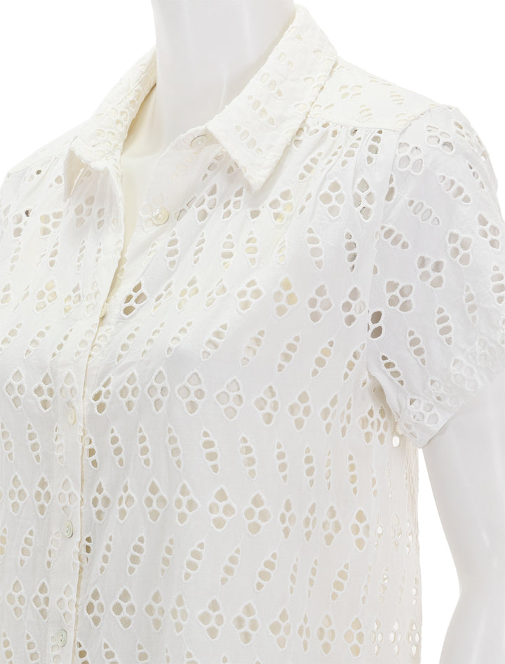 Close-up view of Lilla P.'s eyelet short sleeve shirt dress in white.