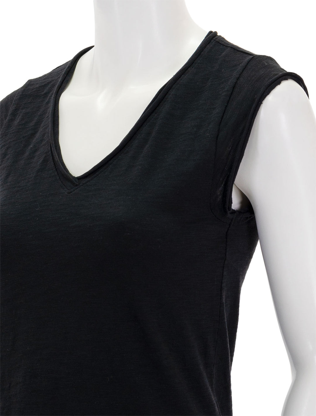 Close-up view of Lilla P.'s cap sleeve v neck tee in black.
