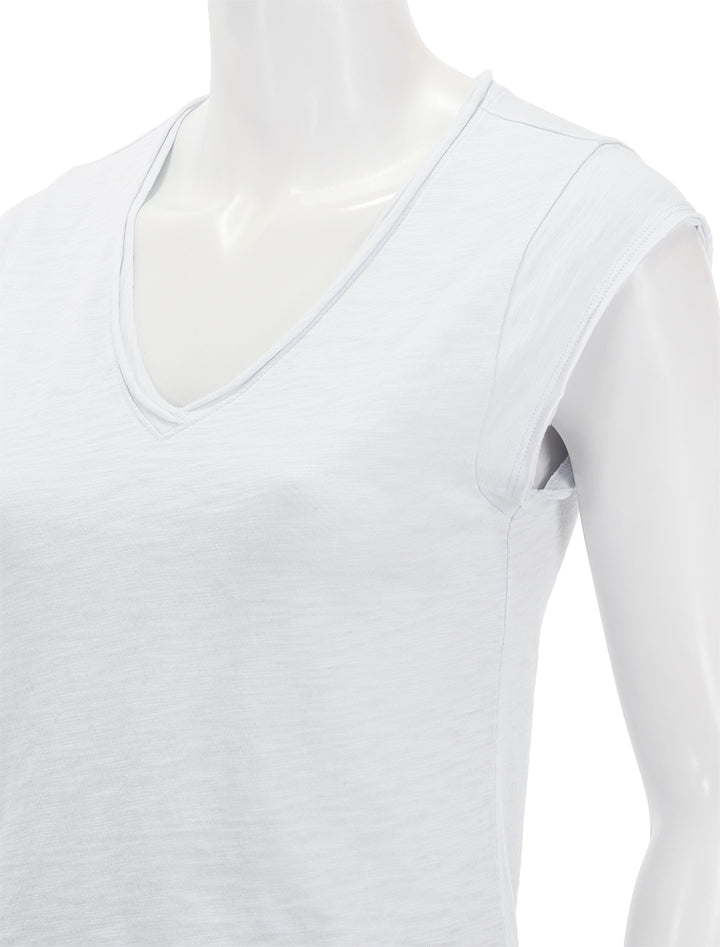 Close-up view of Lilla P.'s cap sleeve v neck in white.