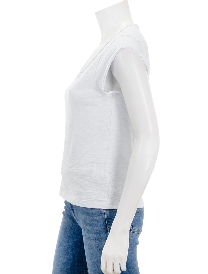Side view of Lilla P.'s cap sleeve v neck in white.