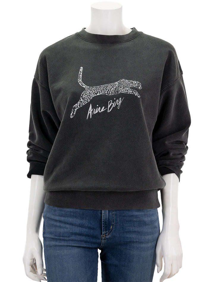 Front view of Anine Bing's spotted leopard spencer sweatshirt in washed black.