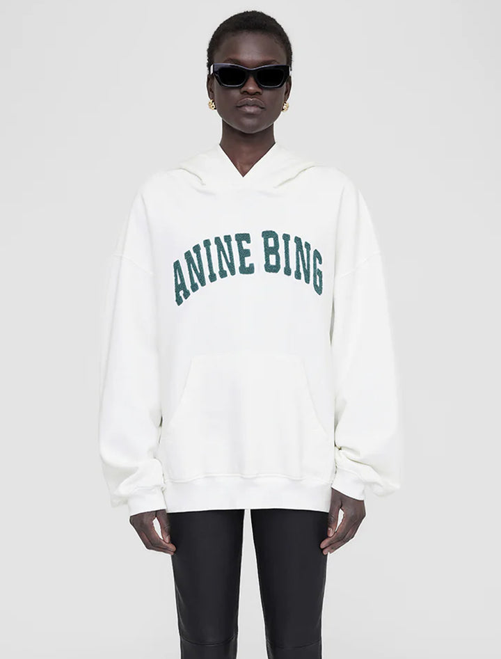 Model wearing Anine Bing's harvey sweatshirt in ivory and sage.