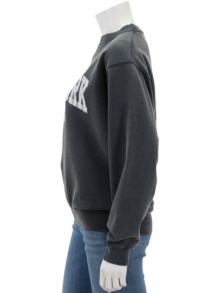 Side view of Anine Bing's new york ramona sweatshirt in washed black.