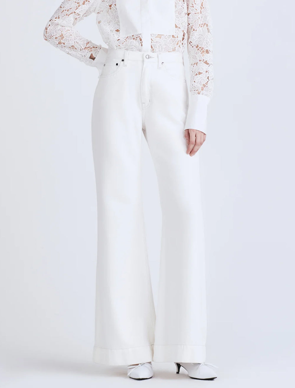 Model wearing Derek Lam 10 Crosby's coralie high rise wide leg in white.