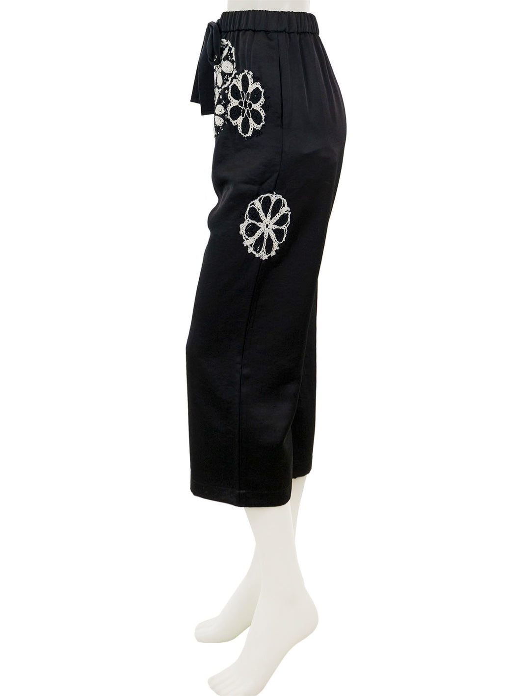 Side view of Saint Art's nova crochet pants in black and ivory.