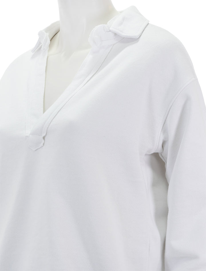 Close-up view of Splendid's cassie long sleeve terry polo in white.
