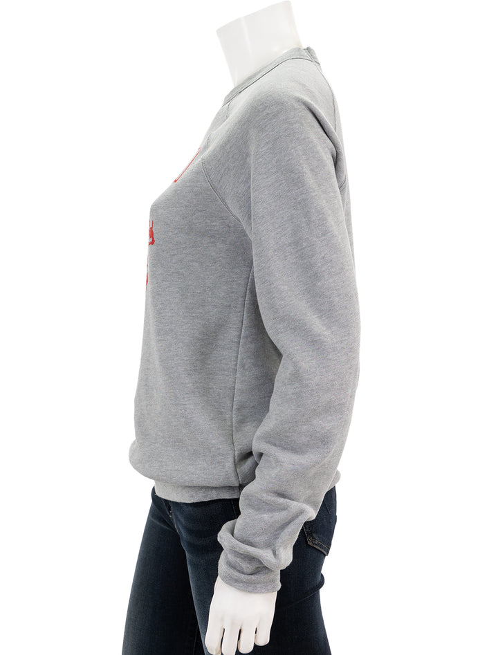 Side view of Recess Apparel's Fleece Raglan Crewneck Sweatshirt in Grey.