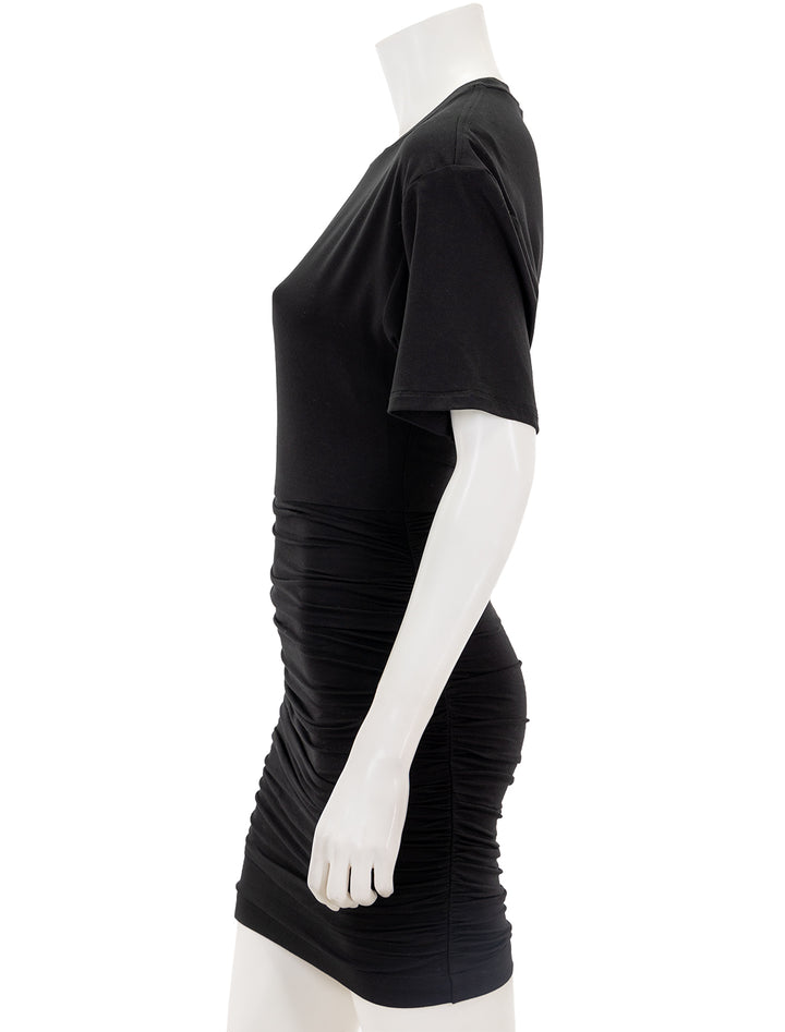 Side view of ATM's matte jersey ruched mini dress in black.