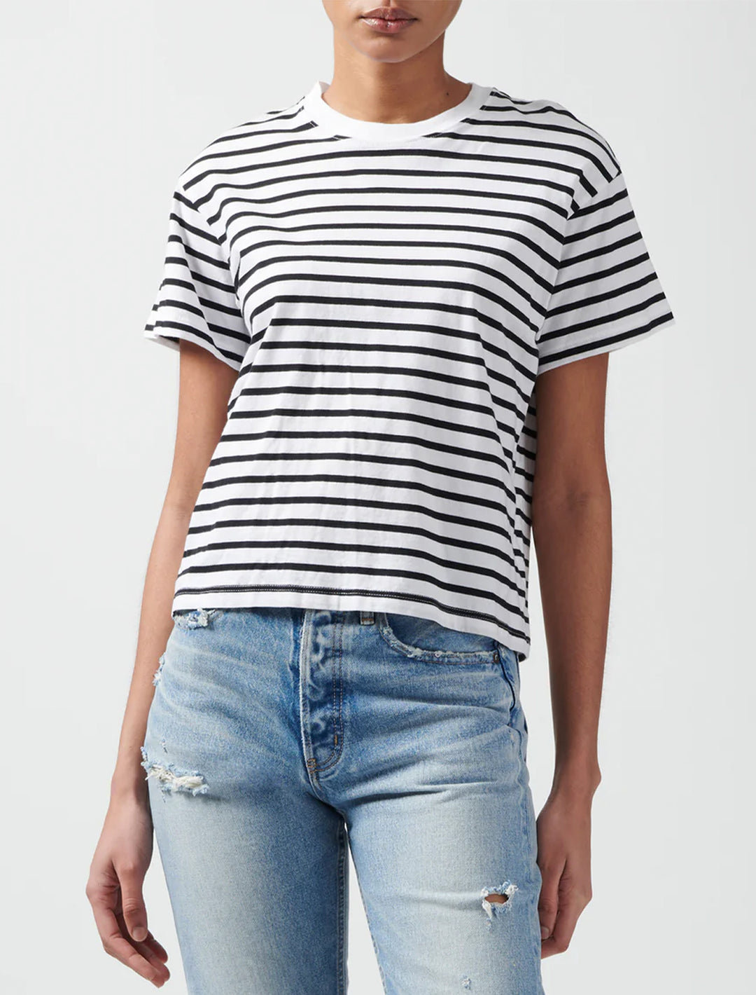 Model wearing ATM's classic jersey short sleeve stripe boy tee in black and white stripe.
