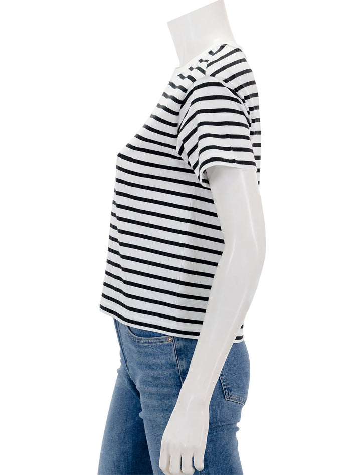 Side view of ATM's classic jersey short sleeve stripe boy tee in black and white stripe.