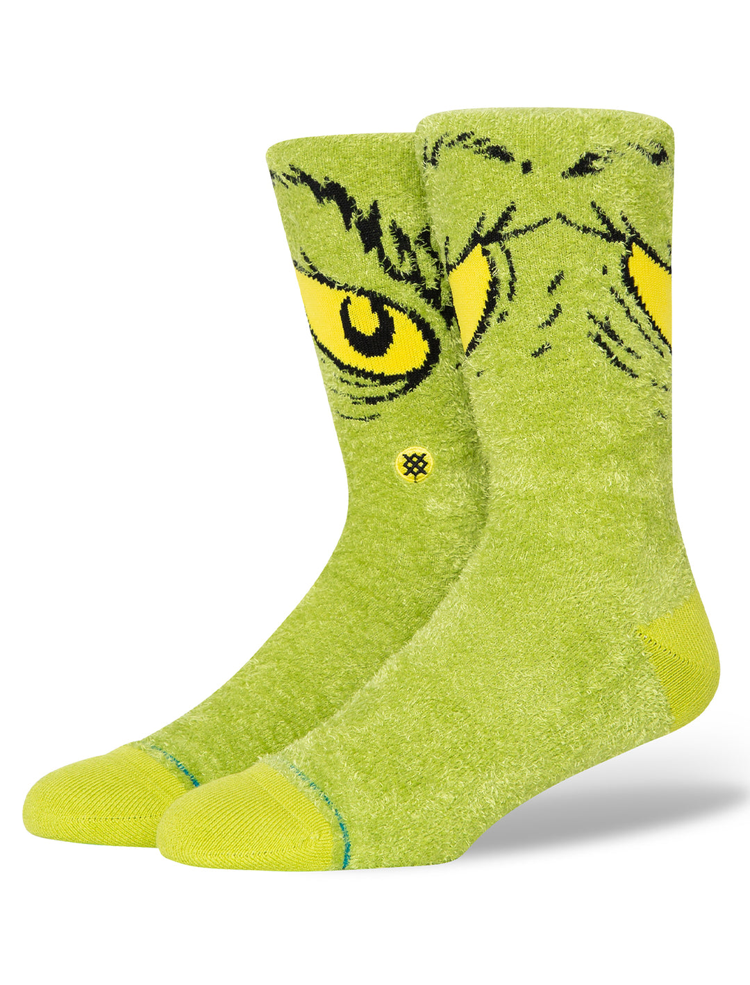 Stance's da da dagrinch cozy crew socks on a foot form.