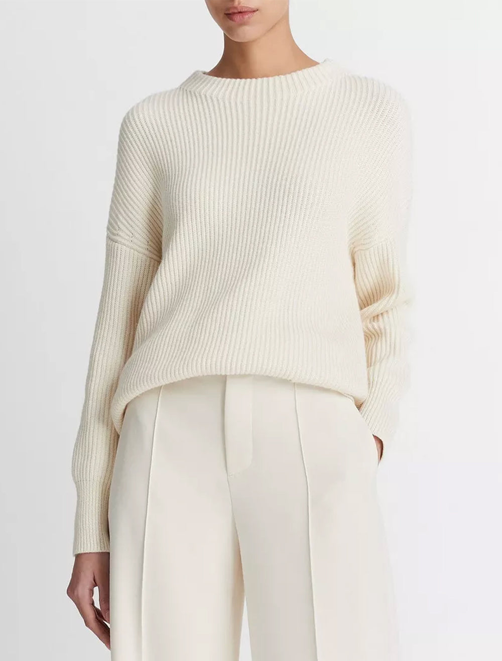 Model wearing Vince's ribbed funnel neck in ivory.