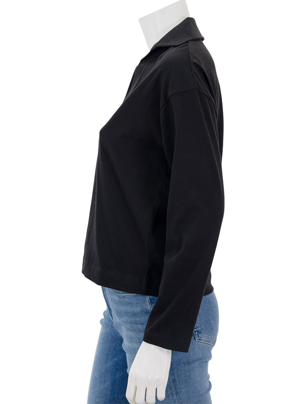 Side view of Vince's easy long sleeve polo in black.
