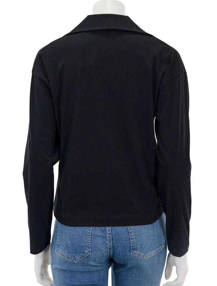 Back view of Vince's easy long sleeve polo in black.