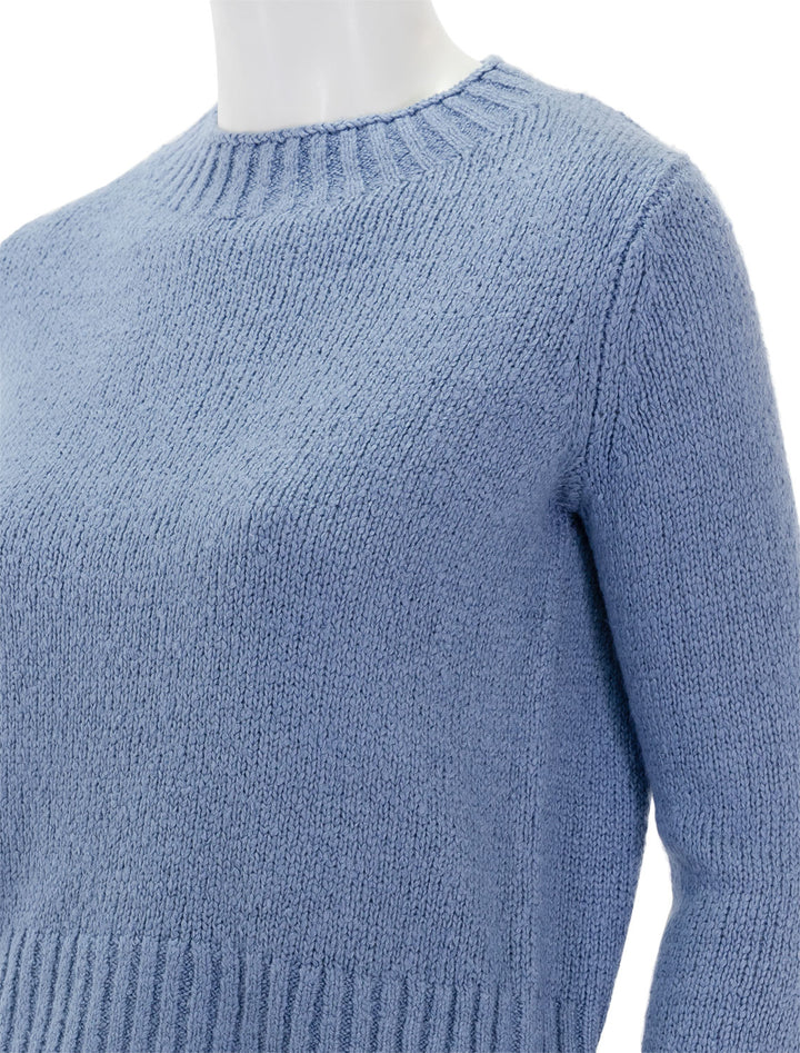 Close-up view of Vince's plush silk crew in azure gem.