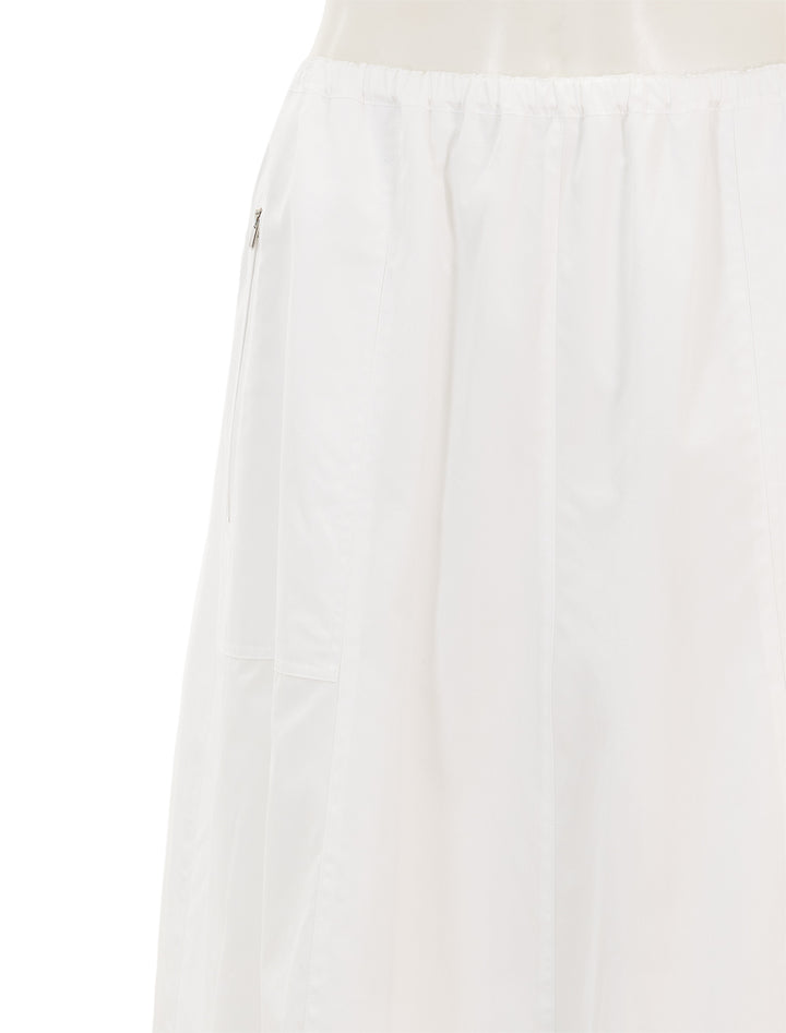 Close-up view of Vince's gathered utility zipper pocket skirt in optic white.