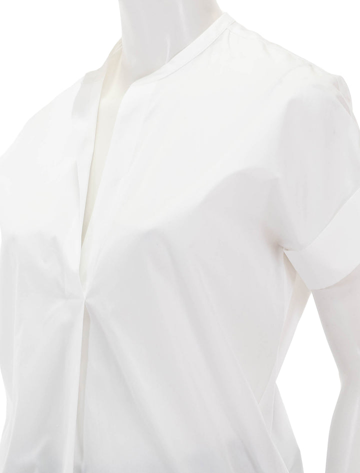 Close-up view of Vince's short sleeve dolman sleeve pullover in optic white.