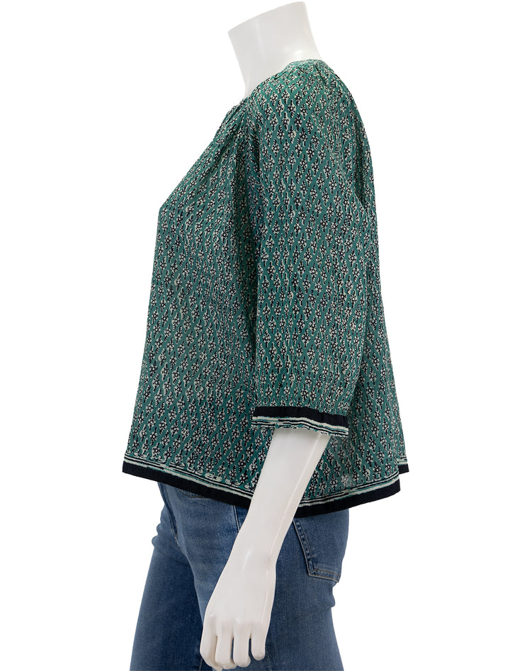Side view of MABE's mari print top in green.