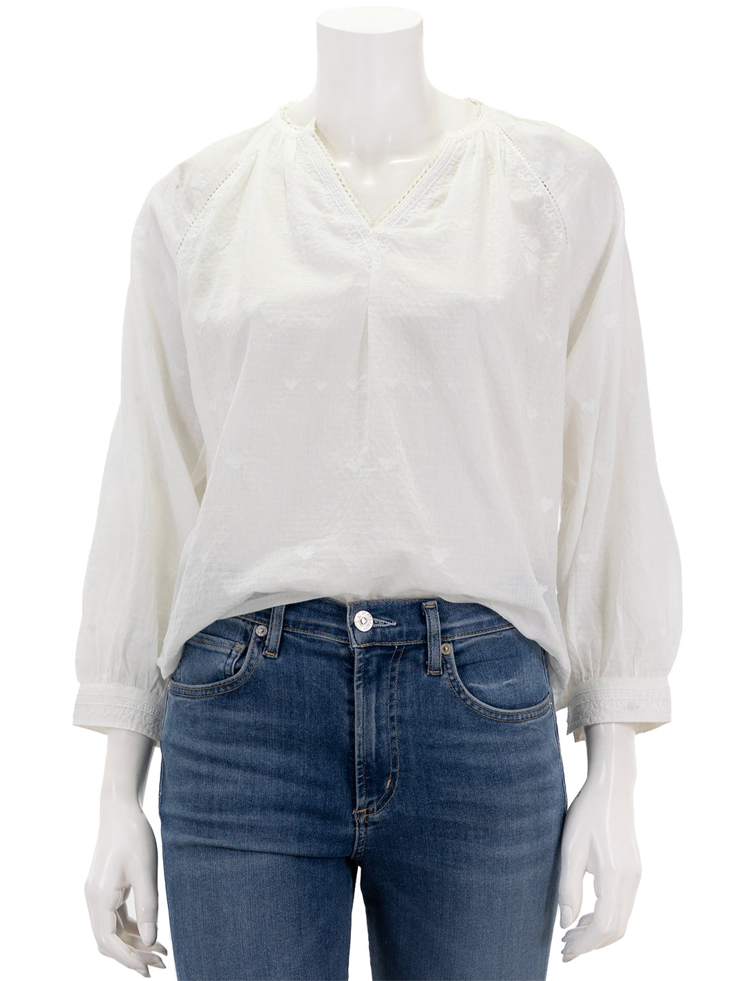 Front view of MABE's elani embroidered heart blouse in white.