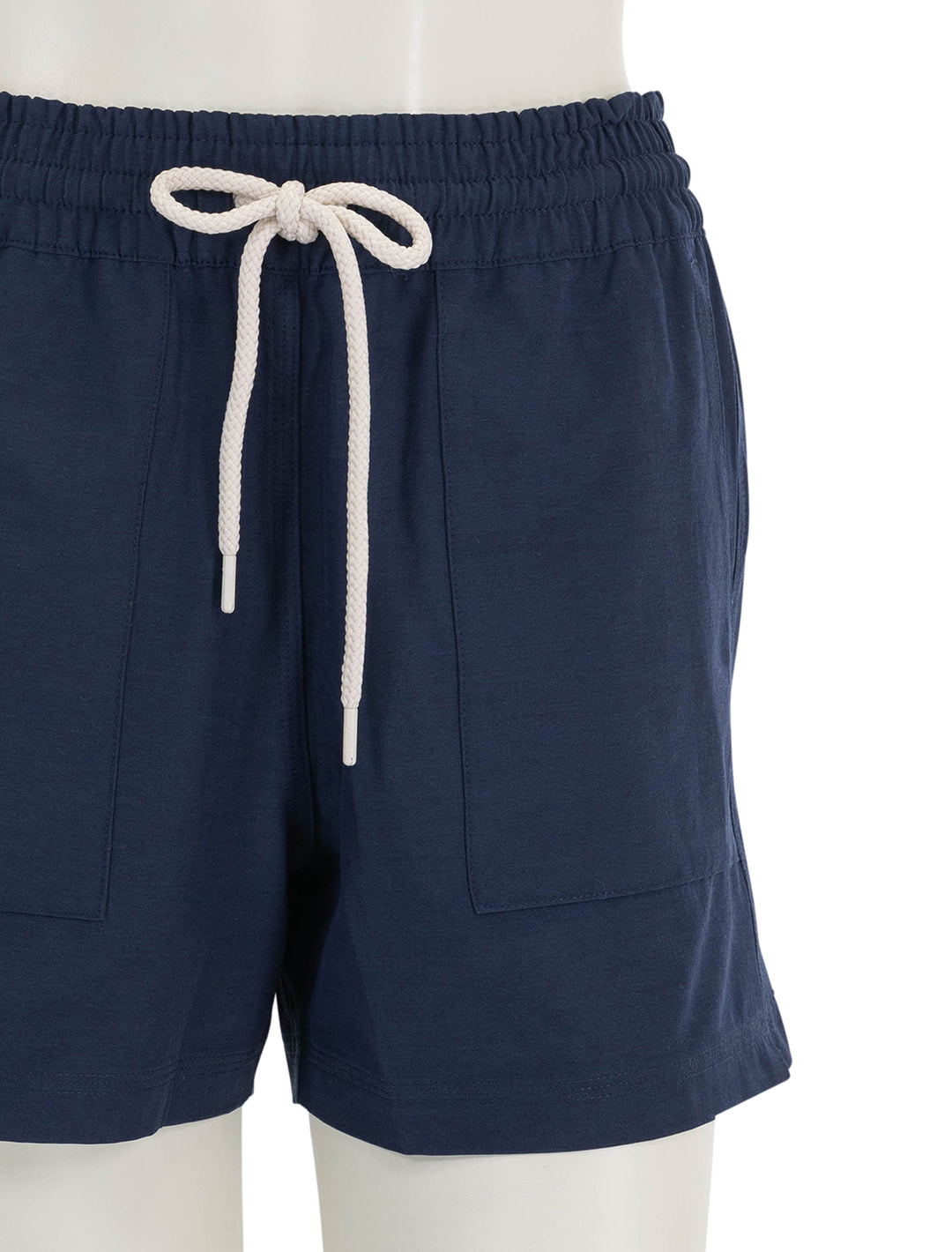 Close-up view of Faherty's all day short in navy blazer.