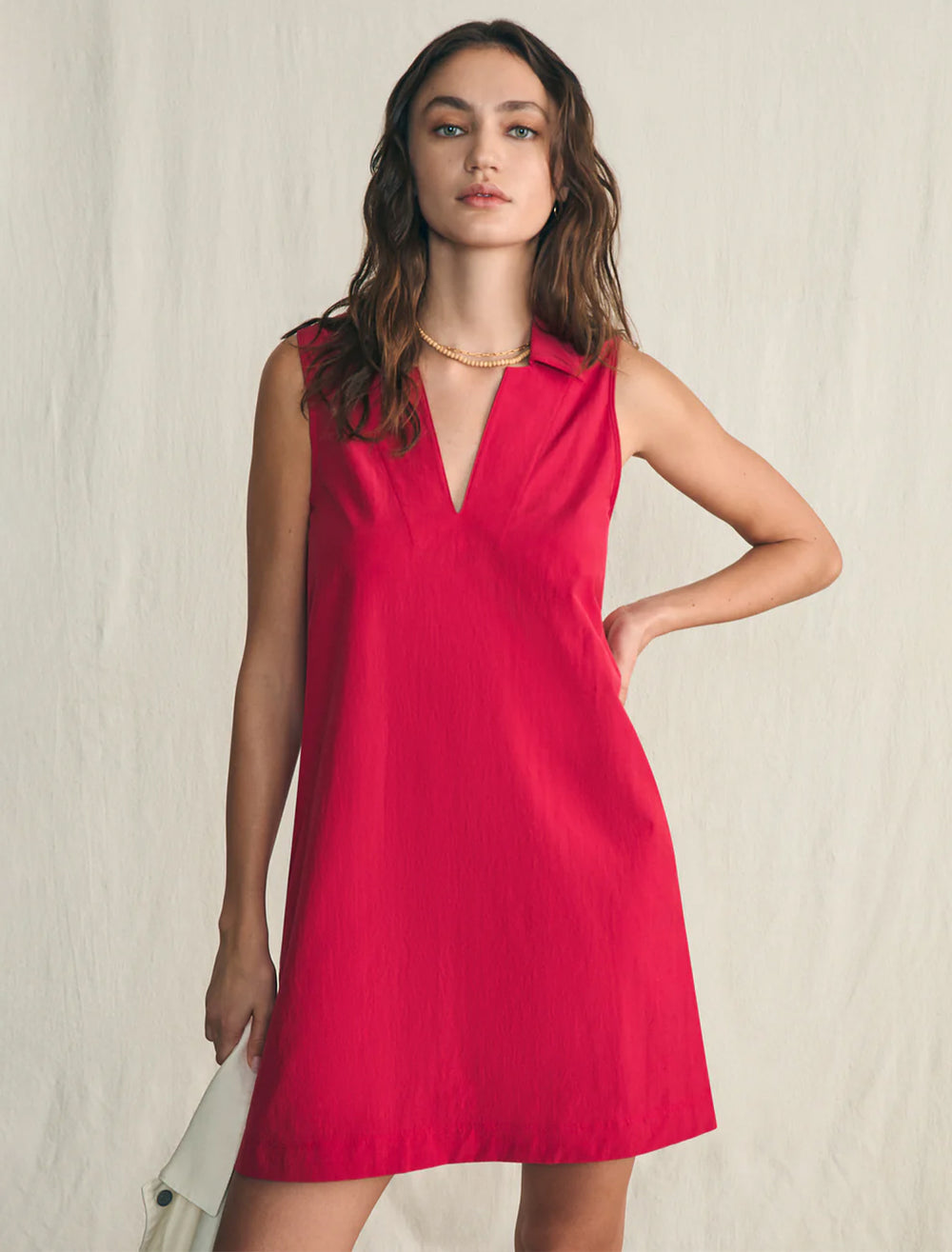 Model wearing Faherty's all day polo dress in granita.