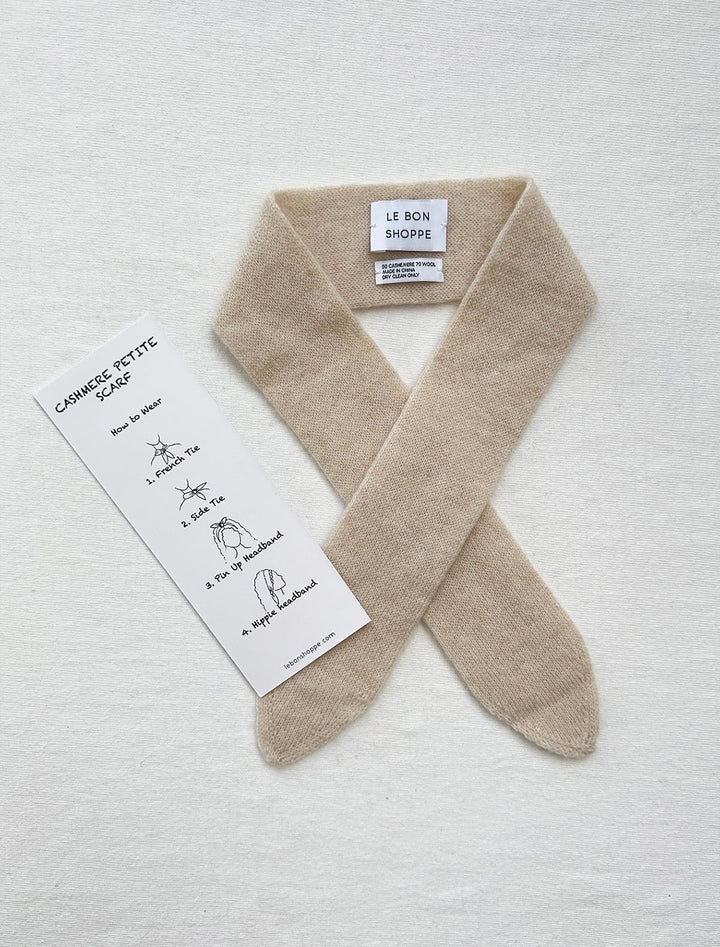 Flat lay of Le Bon Shoppe's cashmere skinny scarf in oats.
