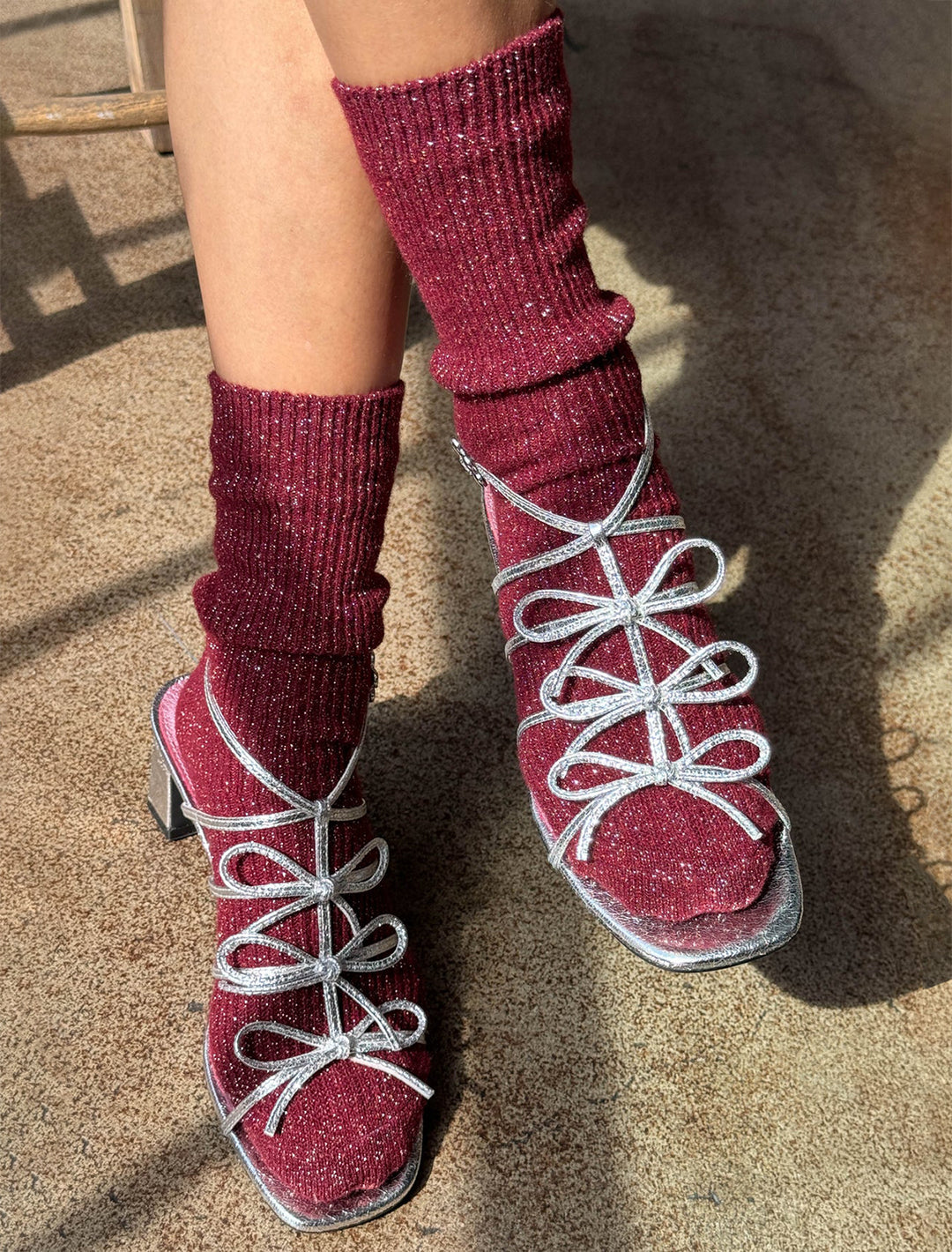 model wearing winter sparkle socks in wine