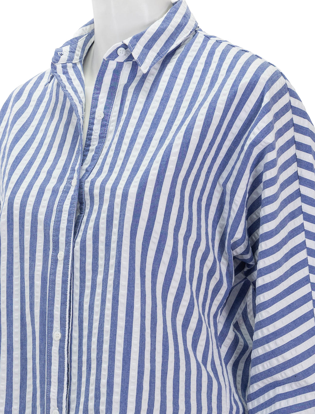 Close-up view of Stateside's puckered stripe dolman shirt in navy stripe.