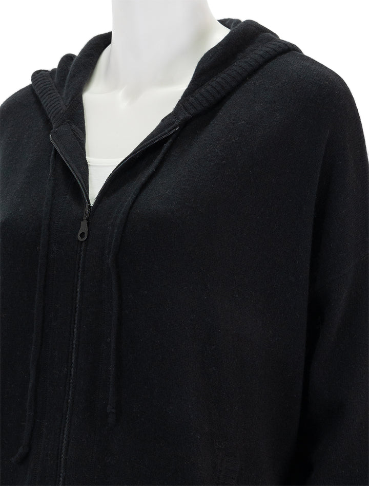 Close-up view of Minnie Rose's cashmere oversize zip hoodie in black.