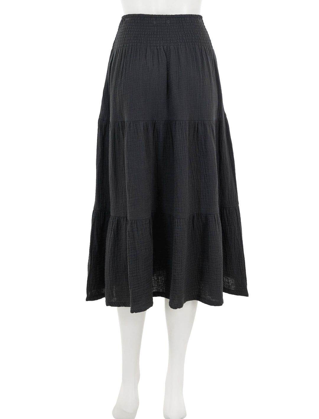 Back view of marine layer's corinne smocked waist maxi skirt in black.