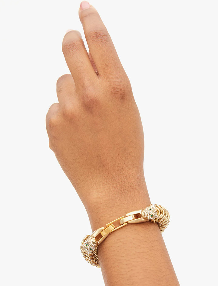 Model wearing Clare V.'s chain statement bracelet in vintage gold.