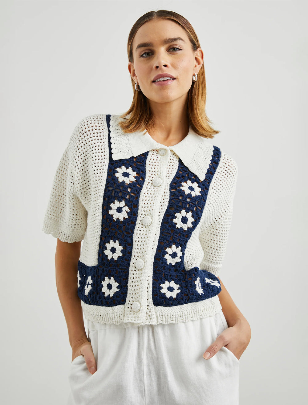 Model wearing Rails' milan crochet daisy top in navy and cream.