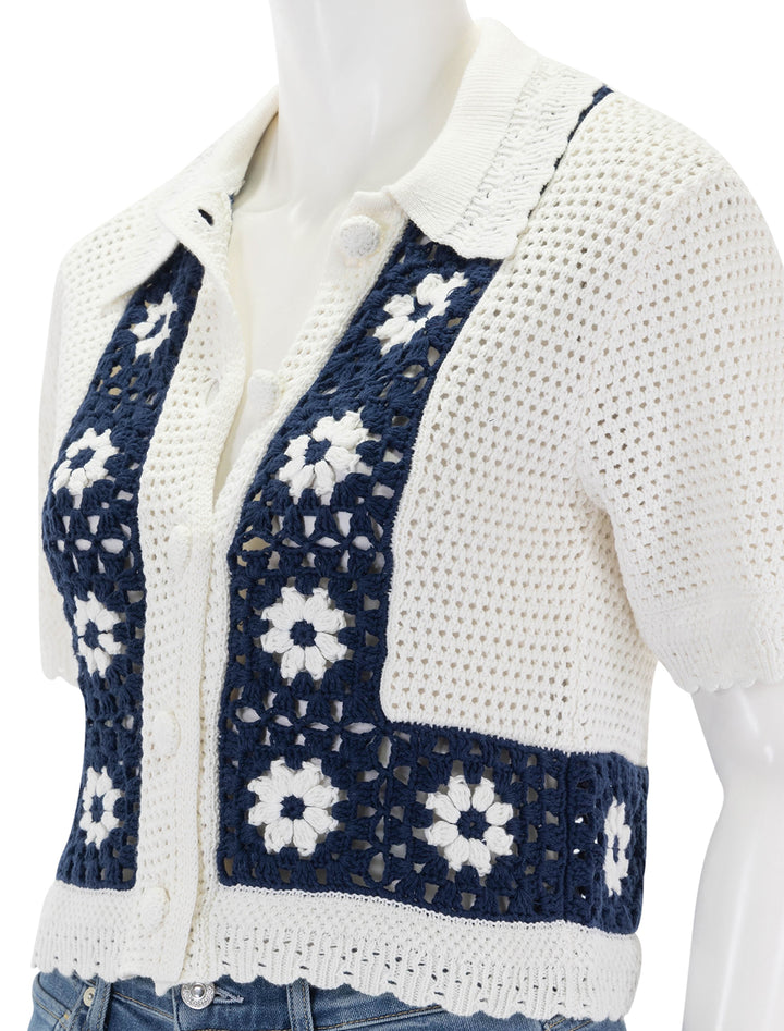 Close-up view of Rails' milan crochet daisy top in navy and cream.