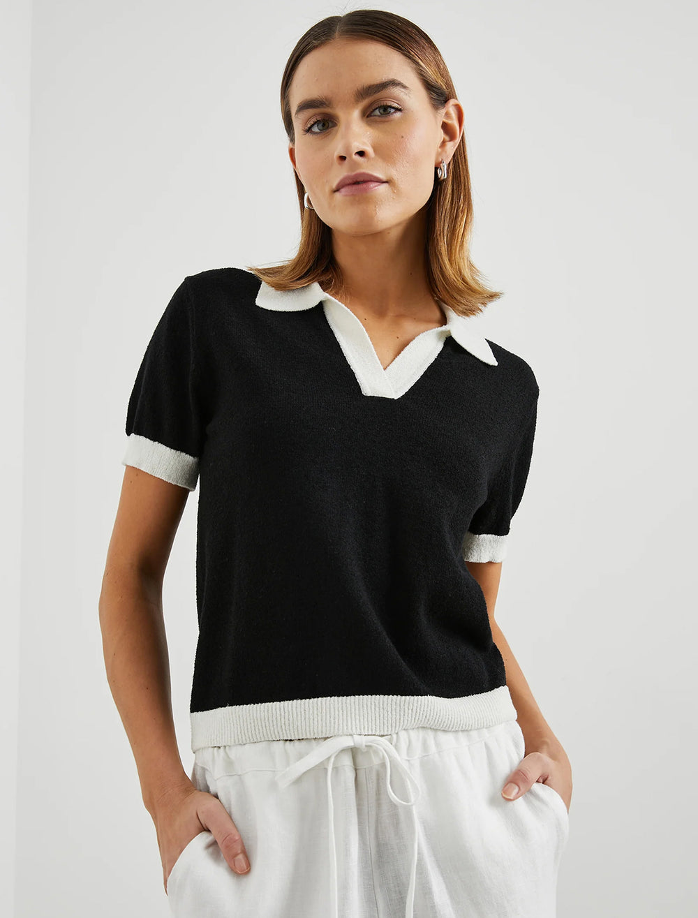 Model wearing Rails' arya knit top in black and white.