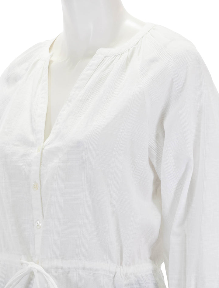 close up view of tie waist top in white