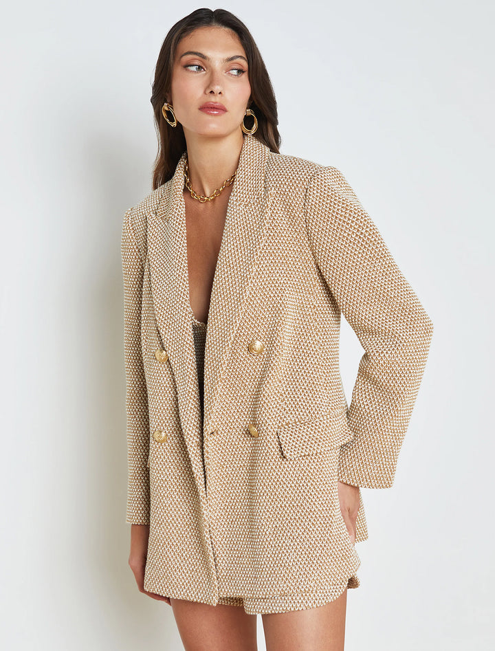 Model wearing L'agence's riva knit double breasted blazer in tan and ivory.