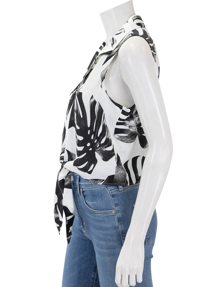 Side view of L'Agence's amos sleeveless tie blouse in black and white palm leaves.