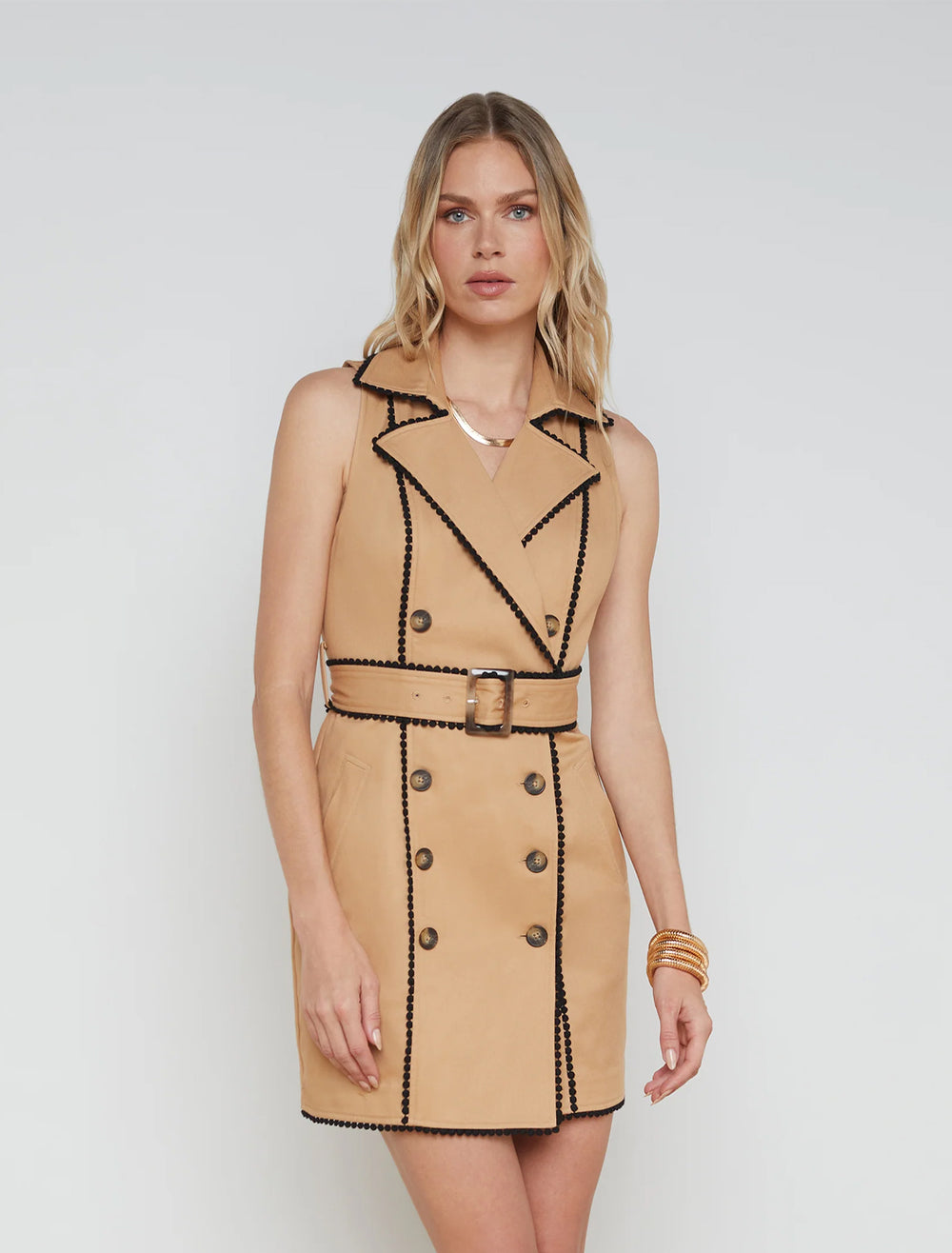 model wearing hale trench mini dress in soft camel