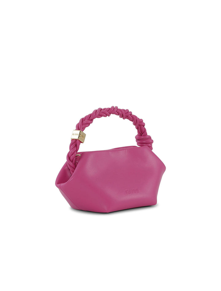 Back angle view of GANNI's mini bou bag in shocking pink.