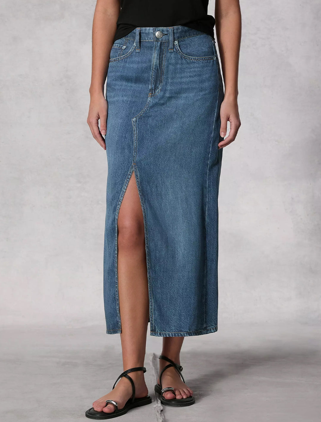 Model wearing Rag & Bone's liquid miramar clara midi skirt in cameron.