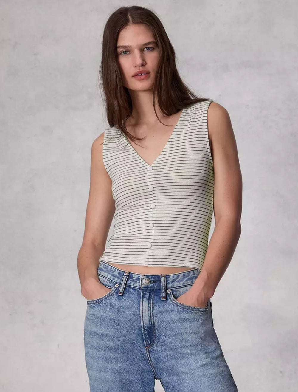 Model wearing Rag & Bone's the knit stripe button up tank in ivorymulti.