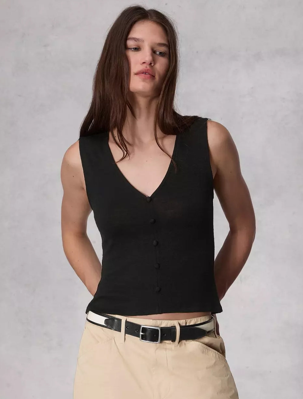 Model wearing Rag & Bone's the knit button up tank in black.