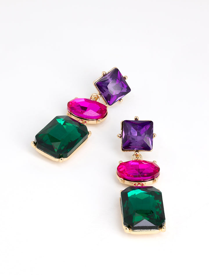 Stylized laydown of AV Max's Emerald, Purple, Fuchsia Triple Stone Statement Earrings.