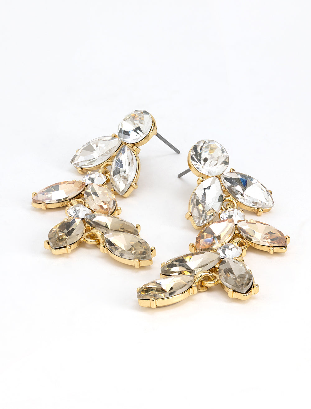 Stylized laydown of AV Max's ombre champagne petal statement earrings.
