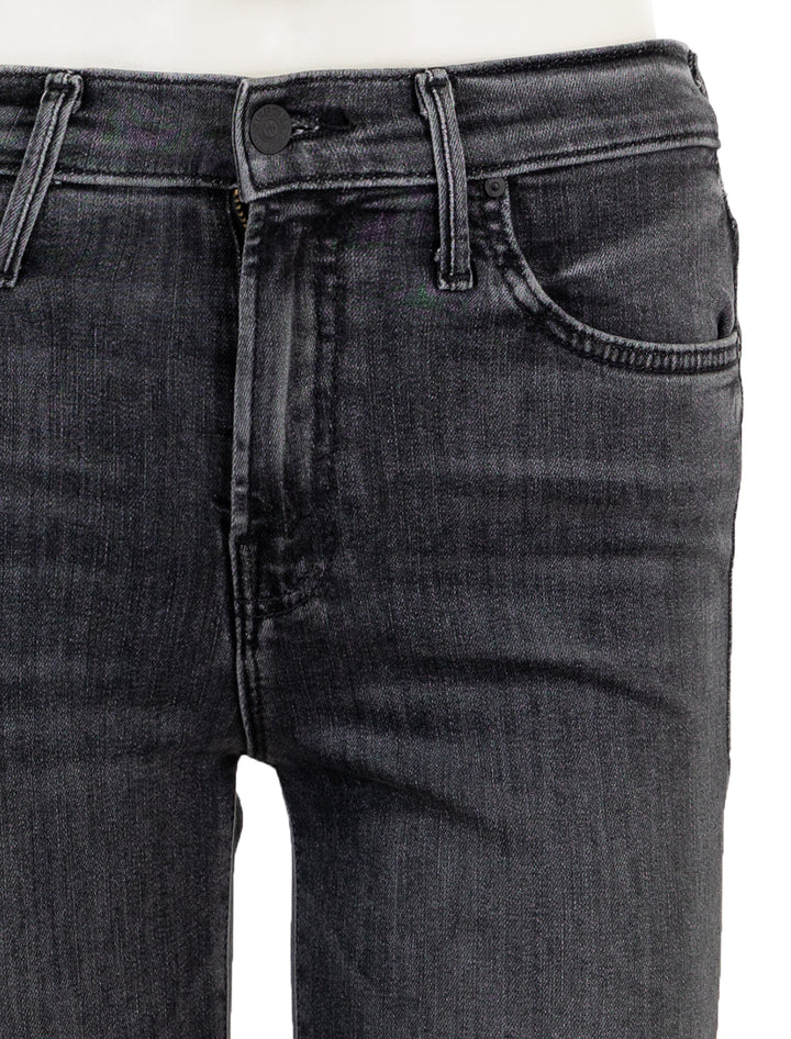 Close-up view of Mother Denim's insider crop step fray in save your soul.